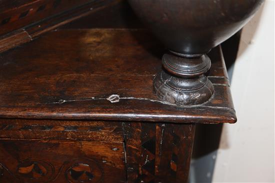 A 17th century marquetry inlaid oak court cabinet W.127cm